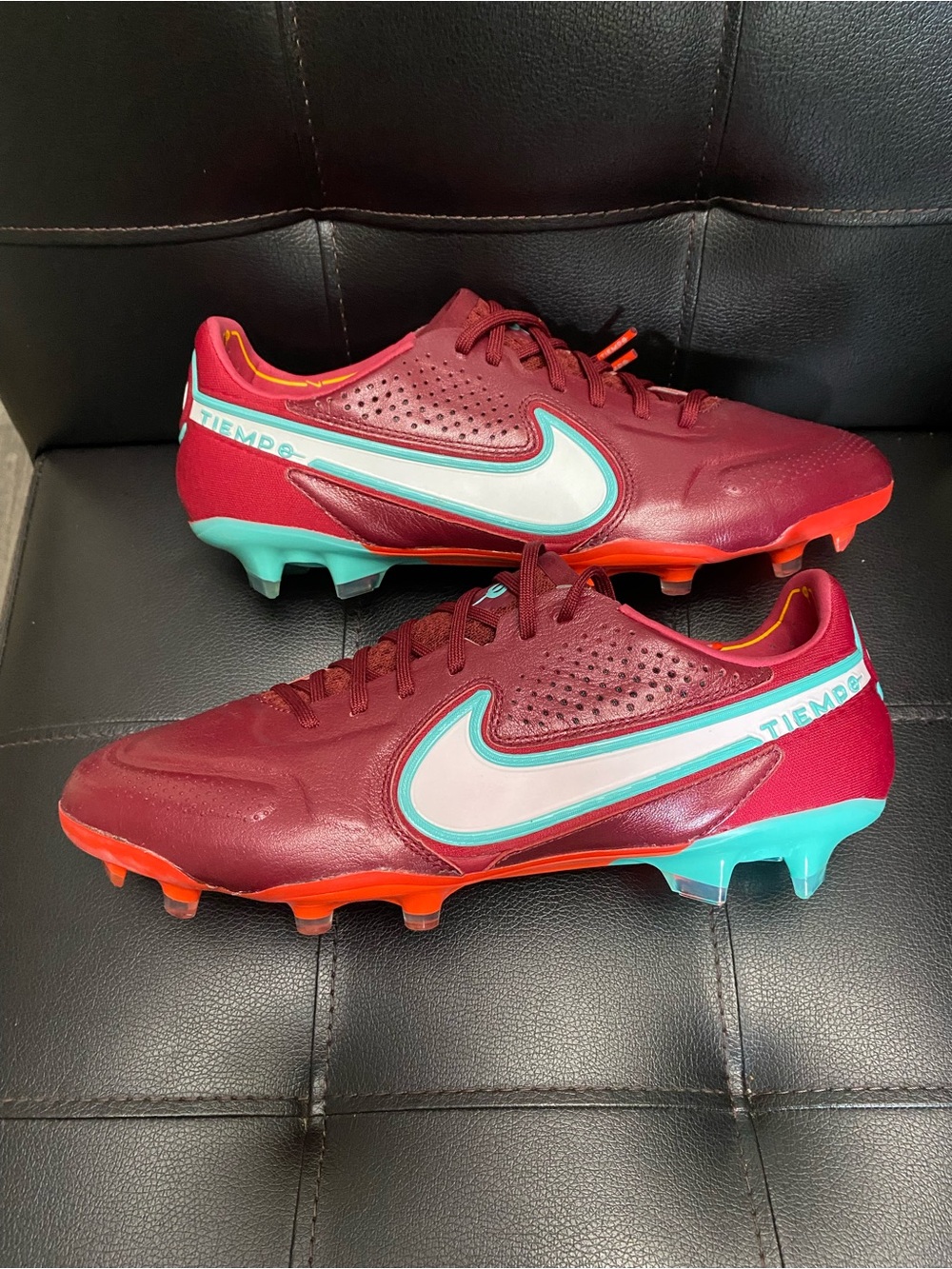 Nike Burgundy Soccer Cleats with Teal & Orange Accents